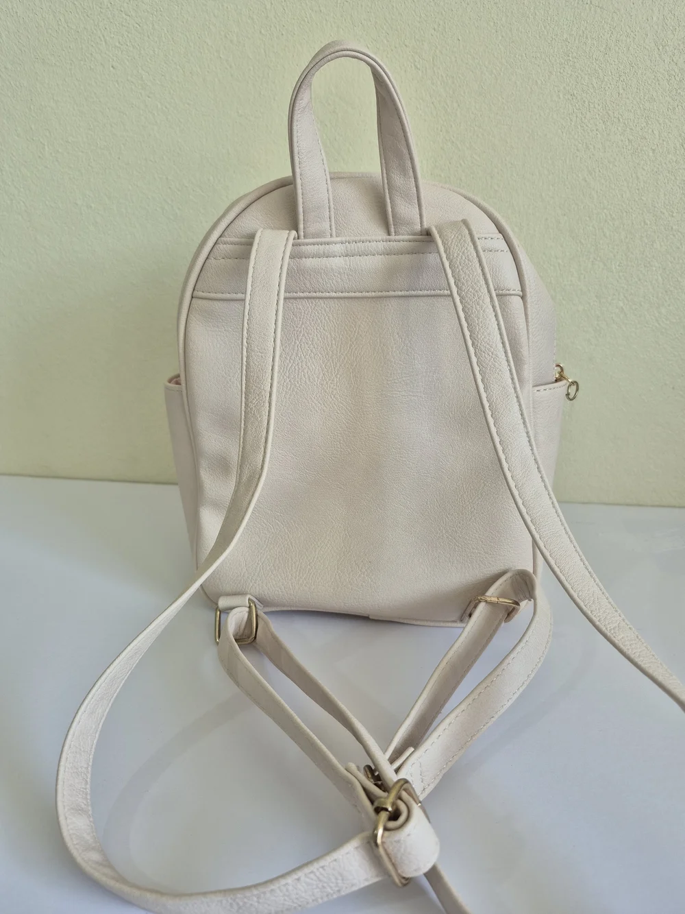 Under One Sky Cream Quilted Backpack with Gold Heart Lock